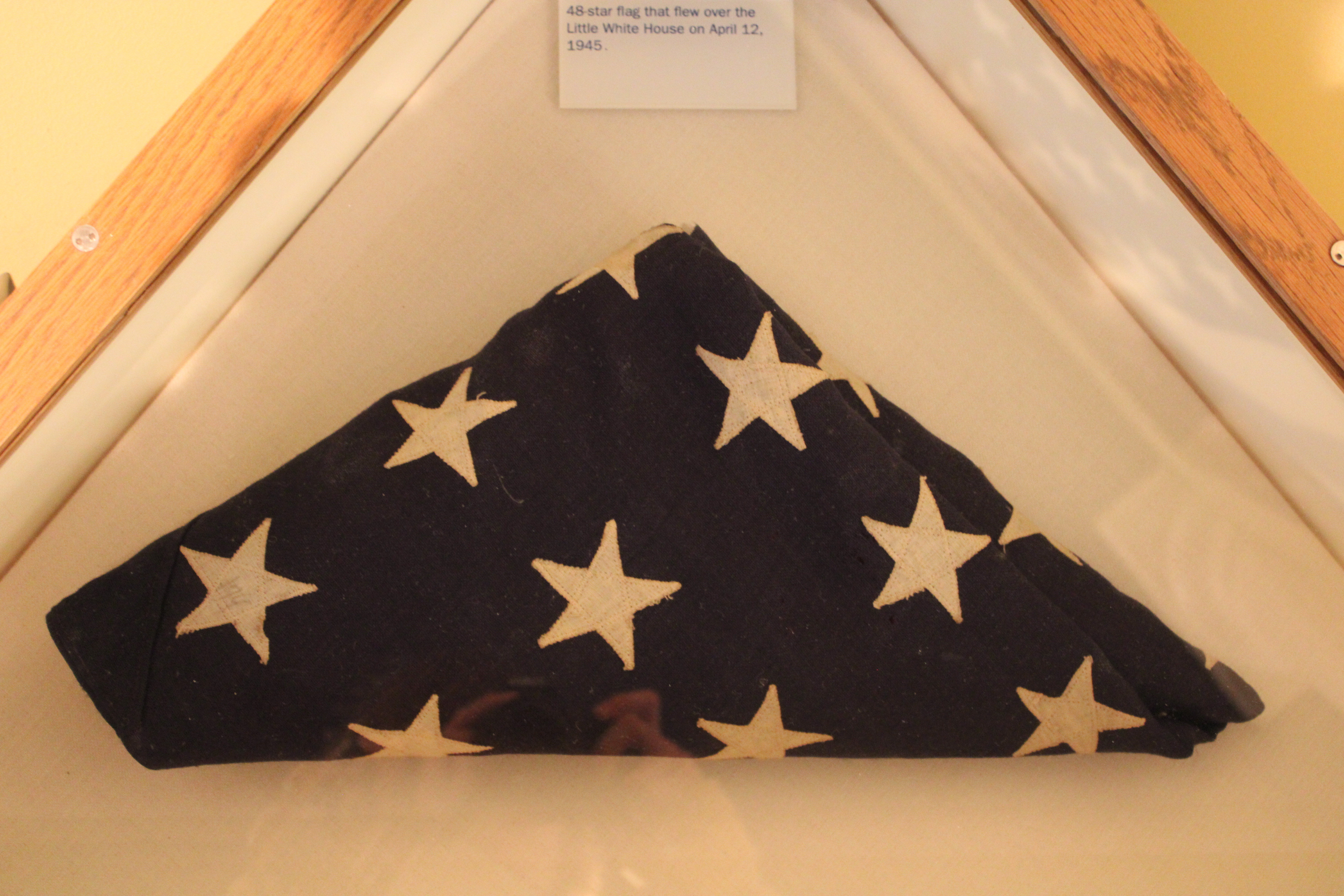 The 48 star American flag that flew over the property on the day that Franklin D Roosevelt passed away. It is folded up in a triangle in the same style as used for veterans.